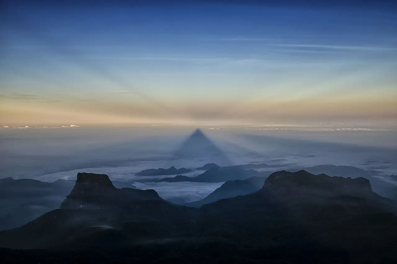 The triangular shadow cast by Adam's Peak at sunrise